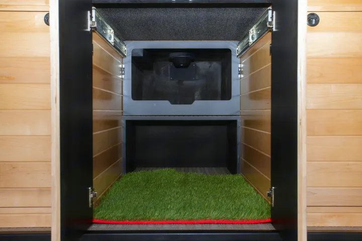 RV rental: Dedicated pet space with artificial grass mat, offering a built-in relief area with ventilation.. Mercedes-Benz Sprinter 2025