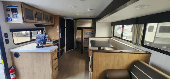 Spacious RV rental interior with kitchen, dinette, and bunk beds. Perfect for family adventures.. Forest River Cherokee Grey Wolf 2026