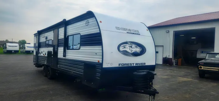 This Forest River Cherokee Grey Wolf travel trailer, ideal for an RV rental, is parked outdoors, ready for adventure.. Forest River Cherokee Grey Wolf 2026