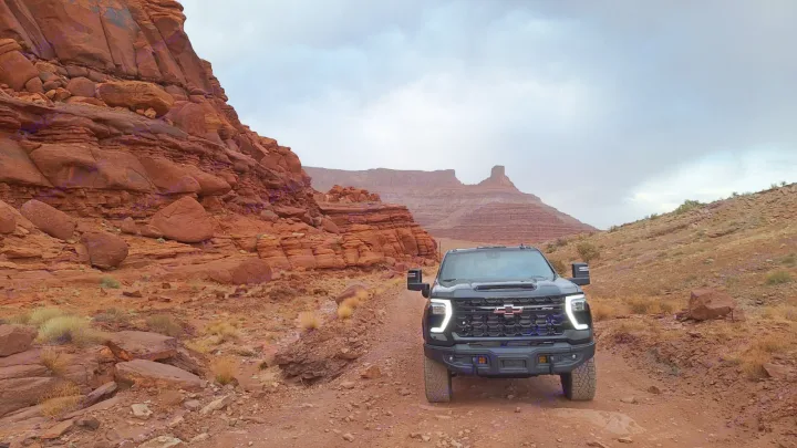 Experience adventure in a black Chevy truck, exploring areas an RV rental might miss. Red rock desert trail.. Chevrolet Silverado 2500HD ZR2 Bison 2025