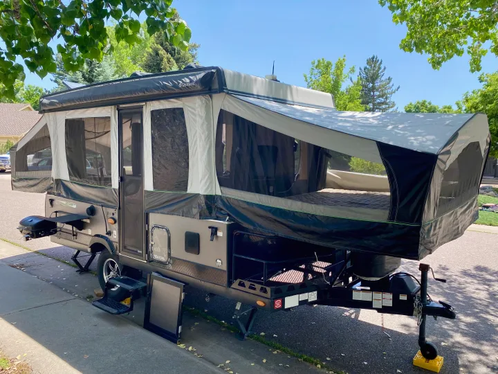 Pop-up RV rental ready for adventure! This fully-set-up camper features outdoor amenities for a comfortable trip.. Forest River Rockwood ESP 2018