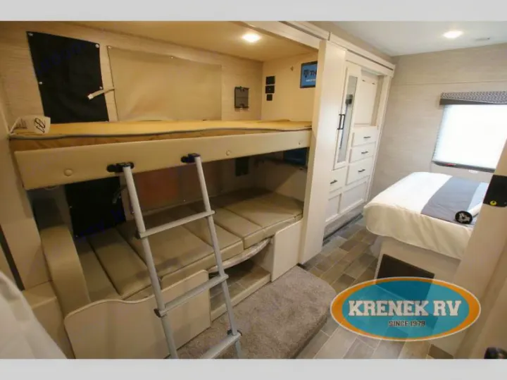 RV rental interior: bunk beds with ladder, convertible lower bunk, ample storage, and main bedroom.. Thor Chateau 2022
