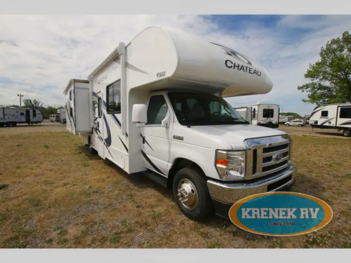 White Chateau Class C RV rental with extended slide-outs parked on a sales lot.. Thor Chateau 2022