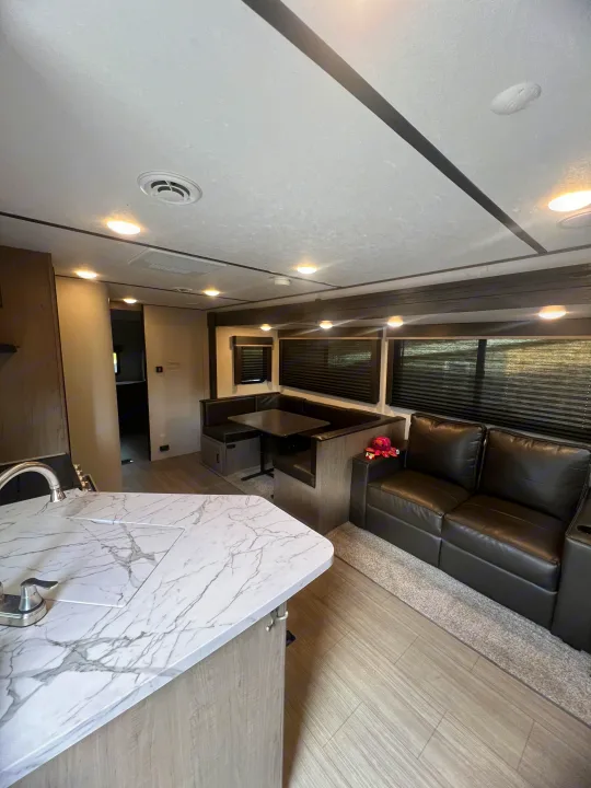 Step inside this inviting rv rental. Features include a modern kitchen, comfortable dinette, and plush sofa, ideal for travel adventures.. Keystone RV Hideout 2021