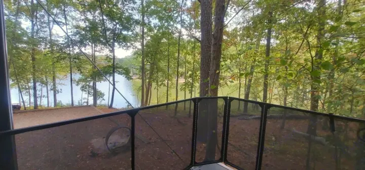 This RV rental offers a stunning elevated view of a tranquil lake and surrounding forest. Ideal for nature lovers.. Forest River Salem 2022