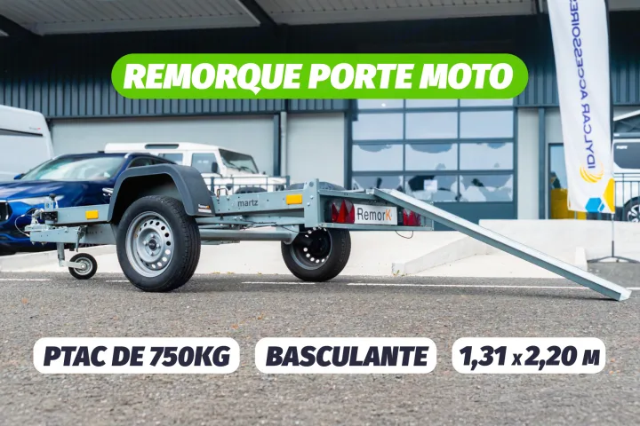 A motorcycle trailer (PTAC 750kg, 1.31x2.20m) with tilt function at an RV rental lot. Perfect for bike transport & hauling.. RemorK Porte Moto 2025