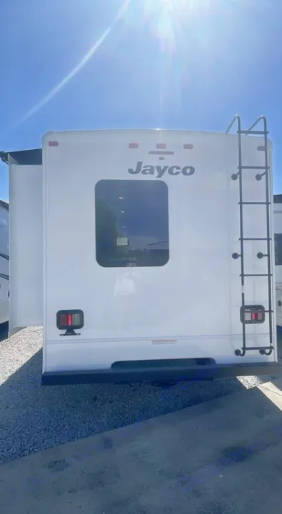 White Jayco RV rental: Rear view showing a ladder & slide-out. Perfect for your next road trip adventure.. Jayco Greyhawk 2026