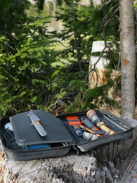 Scenic tent camping by a reflective lake & mountains. An RV rental offers comfortable exploration of nature's beauty.. Kia EV6 Wind All Wheel Drive 2022
