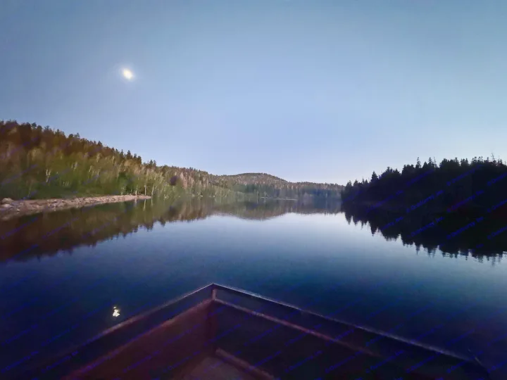 Serene moonlit lake and dark forest reflections. Experience this tranquil beauty on your next RV rental adventure.. Coachmen Leprechaun 2001
