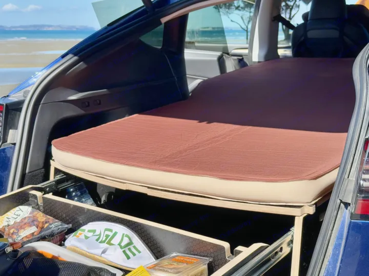 This RV rental alternative features a custom car bed and storage, perfect for beach road trips.. Telstar Model Y 2023