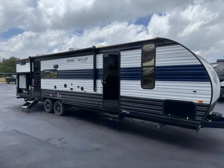 This Grey Wolf travel trailer, an excellent option for rv rental, is ready for adventure with its striking blue and white exterior.. Forest River Cherokee Grey Wolf 2023