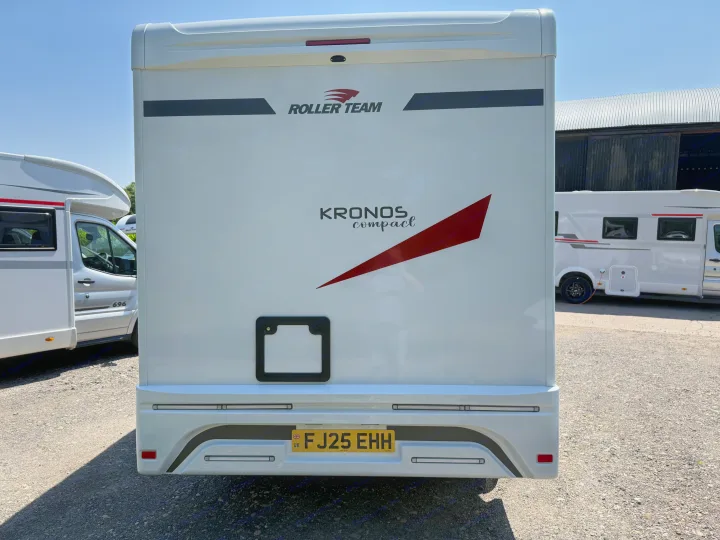Rear view of a white Roller Team Kronos Compact RV, with UK plate FJ25 EHH, ideal for rv rental adventures.. Rollerteam Kronos Compact 590 2026
