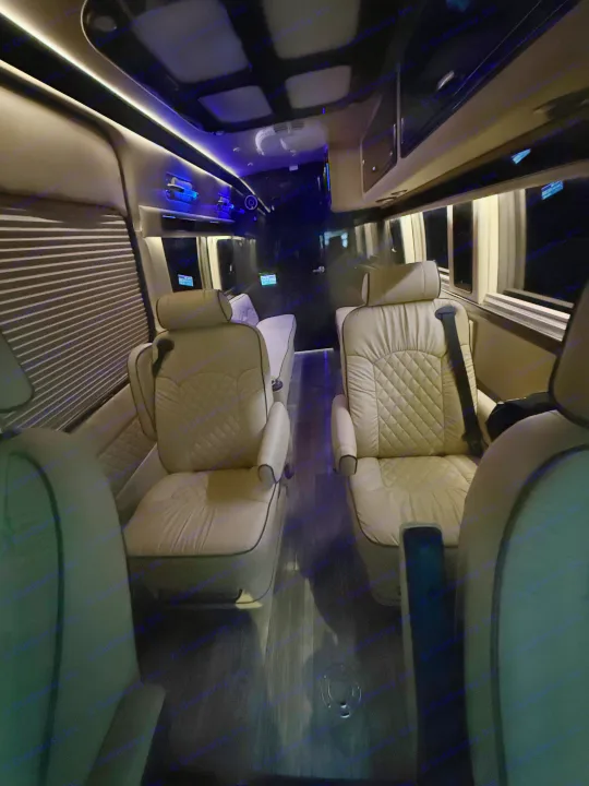 Premium RV rental interior with plush, quilted seats, ambient lighting, and modern design for comfortable travel.. Ultimate Toys Ultimate RV 2021
