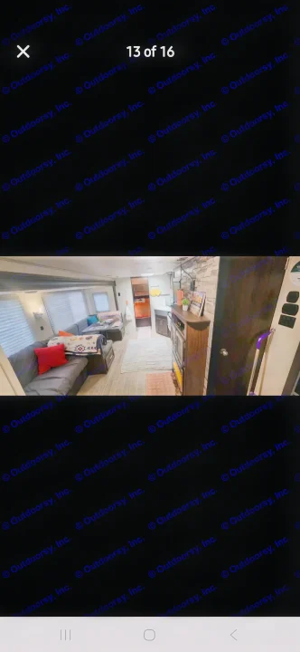 Cozy RV rental interior showing a spacious living area with sectional, kitchen, and a glimpse of the bedroom.. Forest River Cherokee 2020