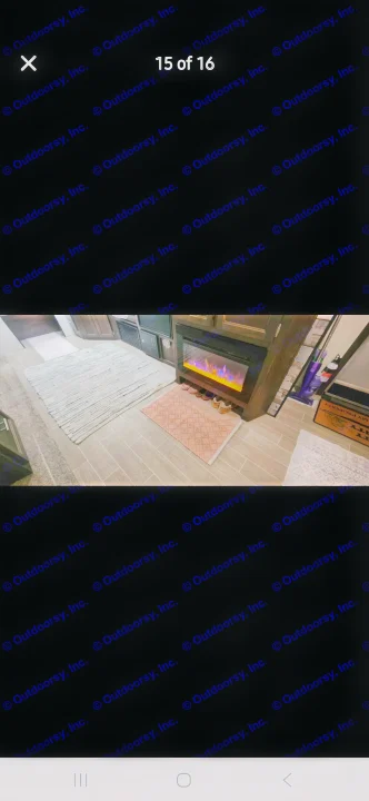 Cozy RV rental living area featuring an electric fireplace, stylish rugs, and tiled flooring.. Forest River Cherokee 2020