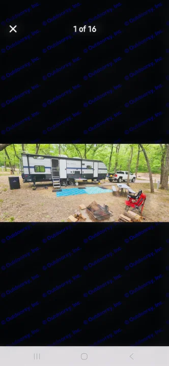 Cozy RV rental campsite with fire pit and truck in a wooded area, perfect for outdoor adventures.. Forest River Cherokee 2020