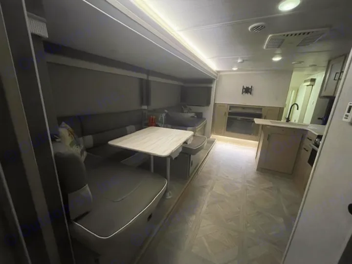Spacious RV rental interior featuring a modern kitchen, comfortable dinette, and living area. Perfect for your next adventure.. Forest River Wildwood X-Lite 2023