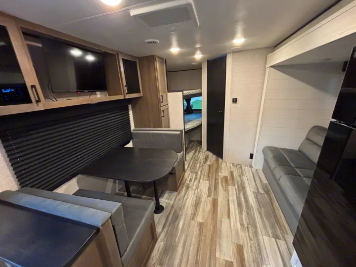 Spacious RV rental interior featuring a cozy dinette, modern kitchen, and comfortable living area. Perfect for travel!. Jayco Jay Flight SLX 2025