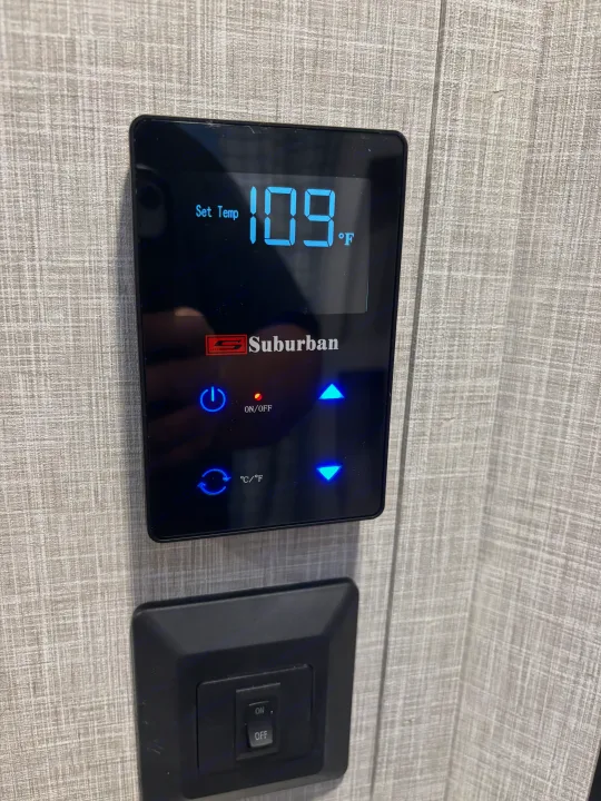 RV rental's Suburban water heater control panel displays 109°F, with power and temperature settings visible.. Jayco Jay Flight SLX 2025