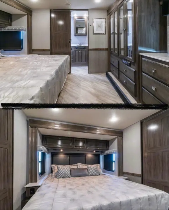 This RV rental showcases a spacious bedroom with a comfortable bed, TV, ample storage, and an adjacent bathroom.. Holiday Rambler Invicta 2021
