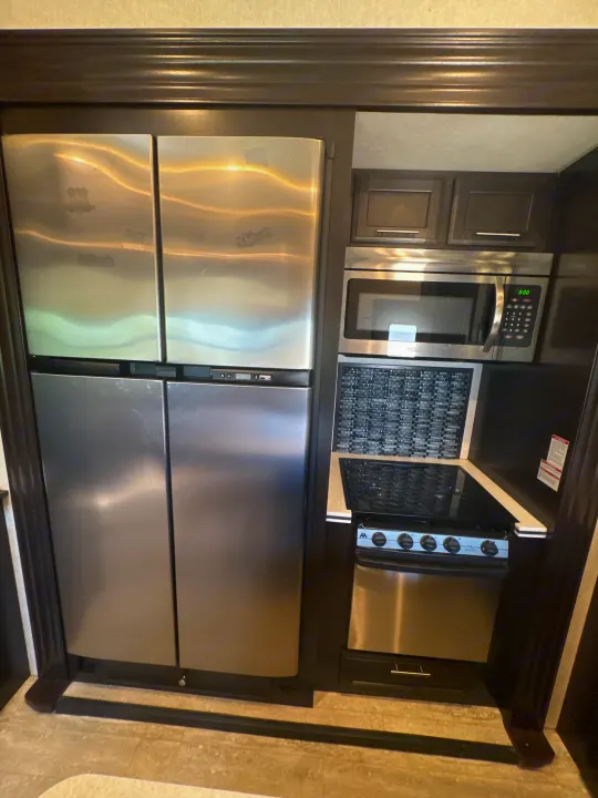 This RV rental boasts a full stainless steel kitchen: large fridge, microwave, and stove.. Jayco Seismic Toy Hauler 2017