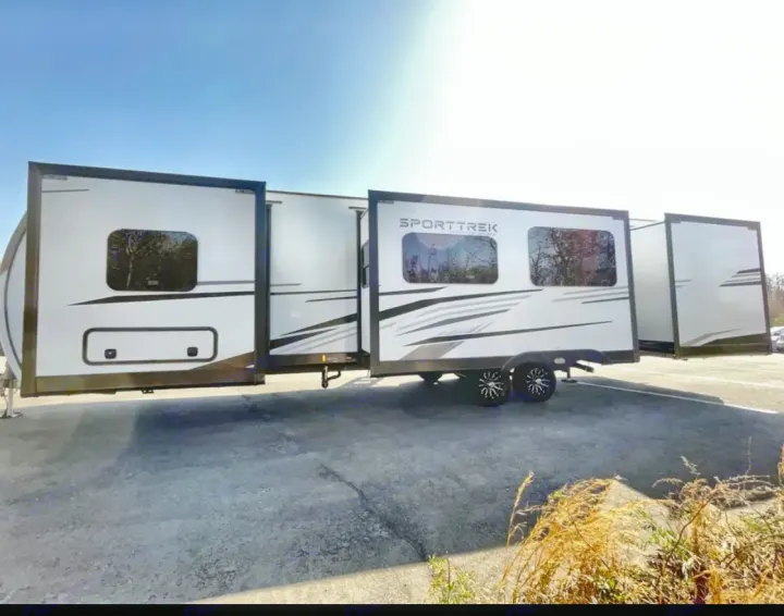 This SportTrek travel trailer RV rental with extended slide-outs offers spacious comfort for your next adventure.. Venture Rv SPORTTREK TOURING EDITION 2025