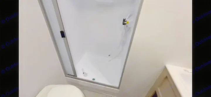 RV rental bathroom: Compact shower stall, toilet, and sink. Perfect for your road trip comfort.. Forest River Salem View 2024