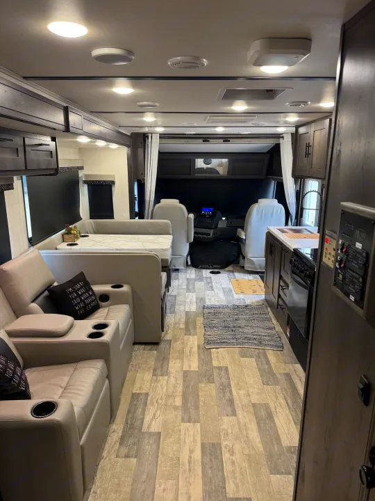 Inside a modern RV rental: living area, dinette, kitchen, and cockpit. Ready for comfortable adventures.. FR3 FR3 Motorhome 2022