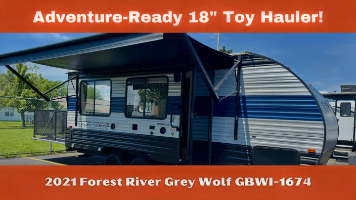 2021 Forest River Grey Wolf GBWI-1674 toy hauler travel trailer with awning extended. Ideal for RV rental adventures.. Forest River Grey Wolf 2021