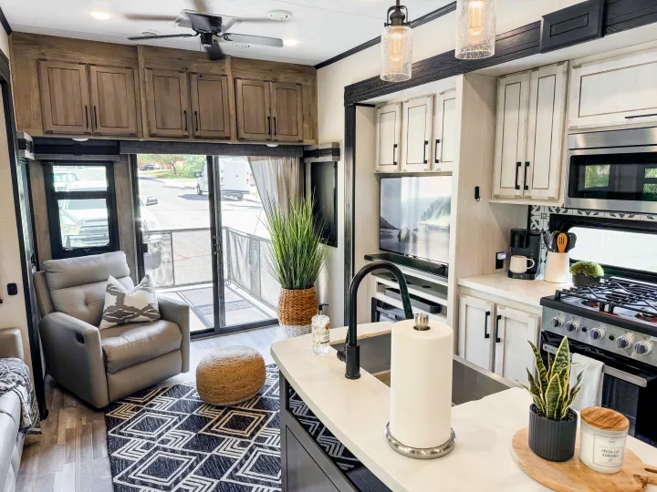 Experience comfort in this RV rental's modern interior, featuring a full kitchen, living area, and convertible patio.. Durango Gold 2023