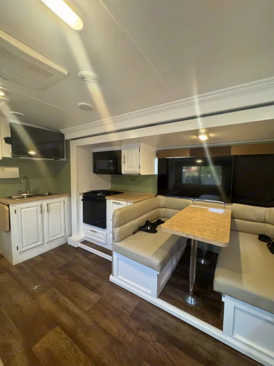 Bright RV rental featuring a well-equipped kitchen, a cozy dinette, and a flat-screen TV. Your home on wheels awaits!. FR3 FR3 Motorhome 2016