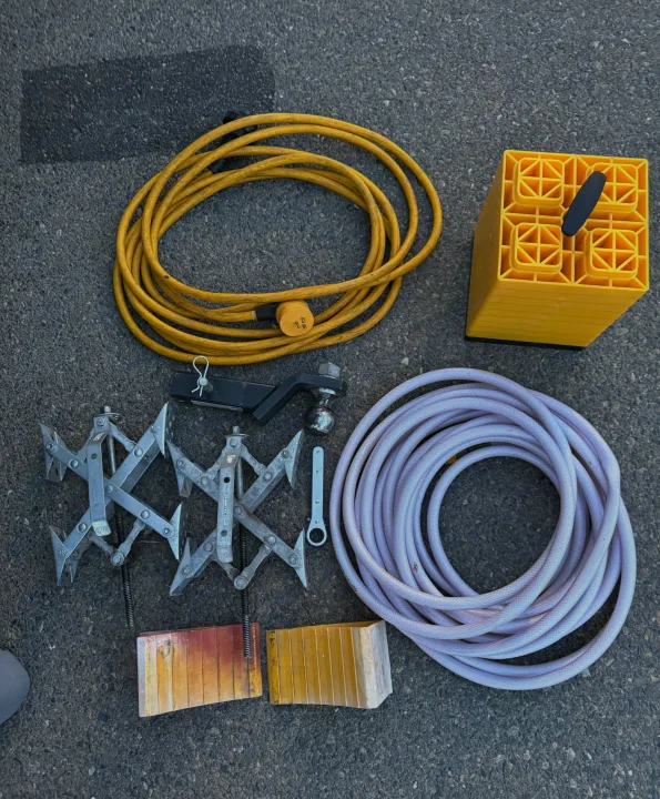 RV rental ready: power cord, water hose, leveling blocks, wheel chocks, & hitch for safe, comfortable camping setup.. Evergreen RV Ascend 2015