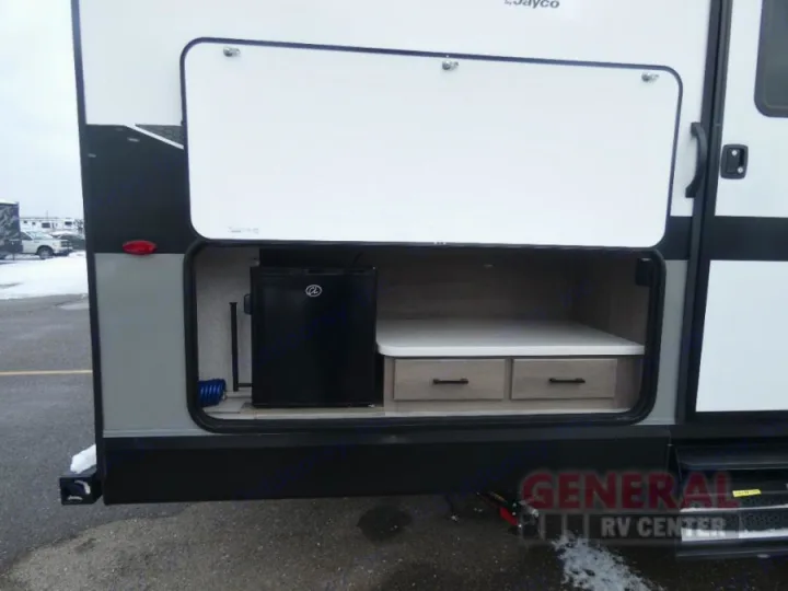 RV rental with open exterior storage: mini-fridge, drawers, and counter.. Jayco Jay Flight SLX 2024