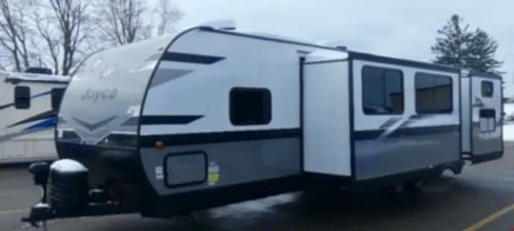 Jayco travel trailer for RV rental. Modern gray and white RV with extended slide-out, ready for outdoor adventures.. Jayco Jay Flight SLX 2024
