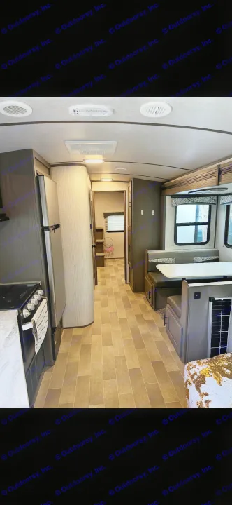 Explore this modern RV rental interior featuring a kitchen, cozy dinette, and convenient bunkhouse layout.. Cruiser RV MPG Ultra Lite 2021