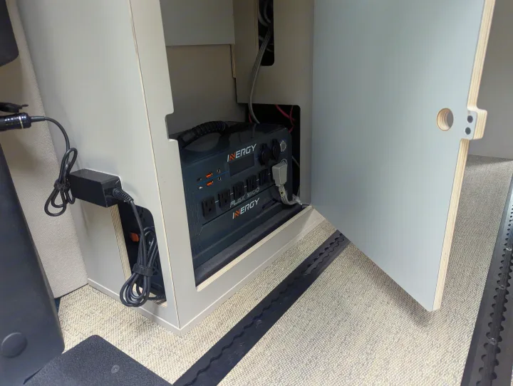 Close-up of an Inergy Flex 1500 portable power station, a key feature in this RV rental, providing power via AC/USB.. Mercedes-Benz Sprinter 2025