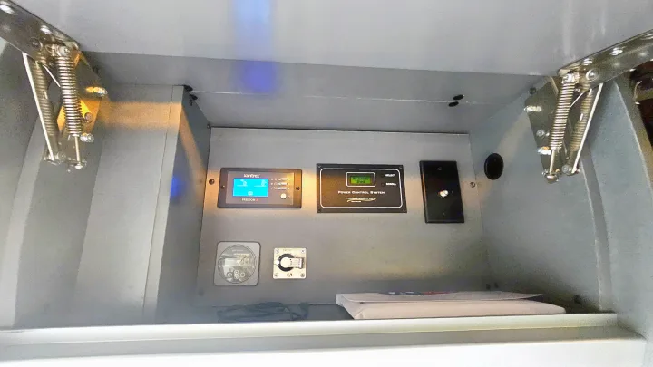 RV rental control center: Xantrex inverter, power control system, battery switch, and tank level gauge.. Airstream Interstate 2024