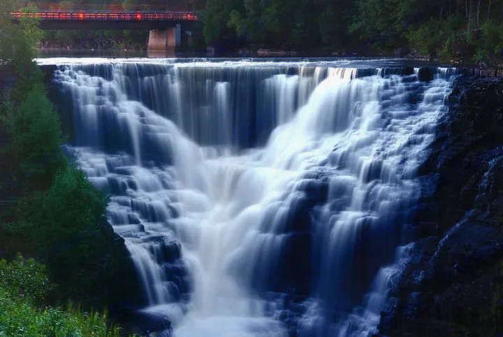 A grand tiered waterfall and distant bridge. Plan your next RV rental adventure!. Jayco Hummingbird 2017