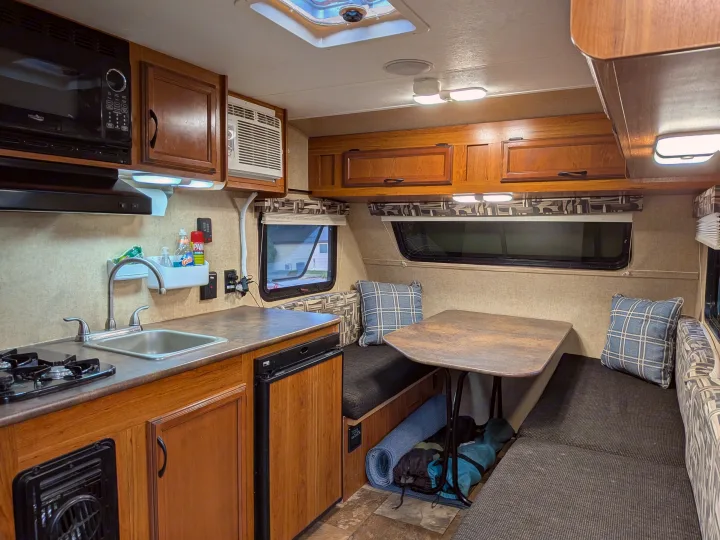 RV rental: well-equipped kitchenette (microwave, sink, stove, fridge), comfortable dinette, and storage.. Starcraft AR-One 2015