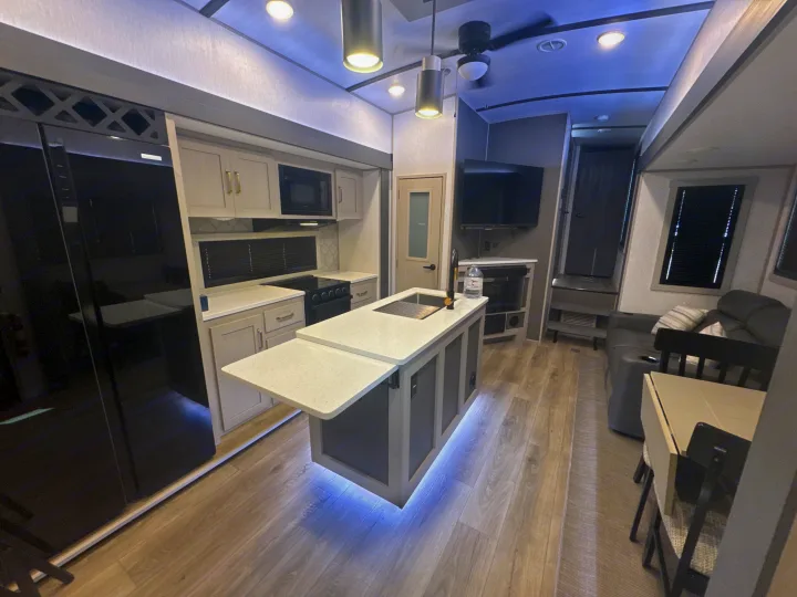 RV rental interior: modern kitchen with pull-out counter, living space, and amenities. Bright & spacious.. Forest River Salem Hemisphere 2024