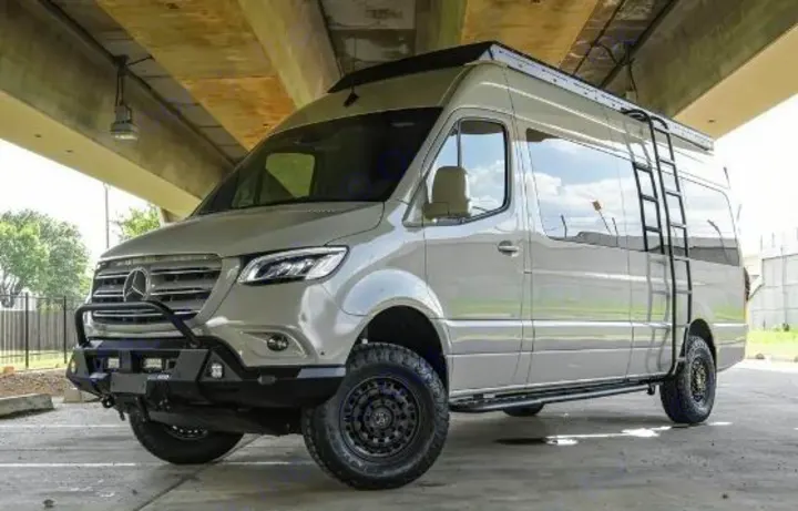 A light gray, off-road Mercedes-Benz Sprinter camper van with custom bumper & ladder, ready for rv rental.. Mercedes Benz Sprinter 2500 2024