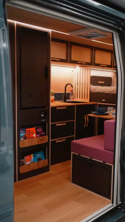 Modern Crozier Campers RV rental interior with a compact kitchen, fridge, smart storage, and cozy seating for travels.. Citroen Relay L4H2 2025