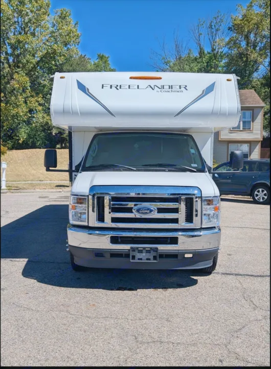Front view of a white Coachmen Freelander Class C RV, built on a Ford chassis, ideal for rv rental adventures.. Forest River Coachmen Freelander 2021