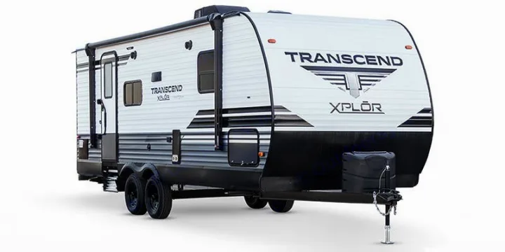 This white and black Transcend Xplor travel trailer, ideal for RV rental, is a two-axle model with a large awning.. Grand Design Transcend Xplor 2022