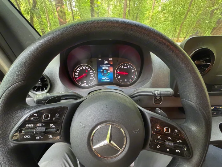 Interior view of an RV rental, showing the Mercedes-Benz steering wheel and dashboard with digital display indicating 72°F & 236 mi range.. Mercedes-Benz Sprinter RV Motorhome Campervan 2022