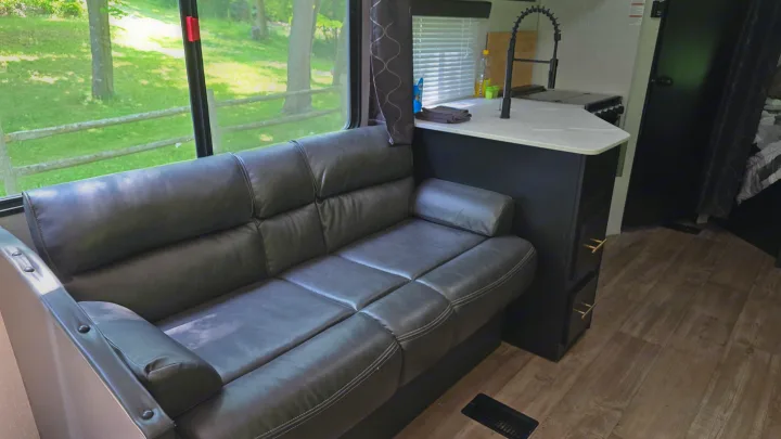 Experience an RV rental! Relax on the comfy sofa, enjoy the view, and cook in the modern kitchen, perfect for your next adventure.. Forest River Cherokee 2022