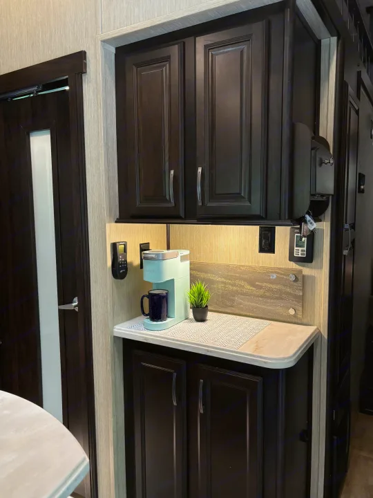 RV rental: Cozy coffee station setup with a light blue Keurig, dark cabinets, and plenty of counter space.. 4x4fcmp23h6007284 Columbus 2017