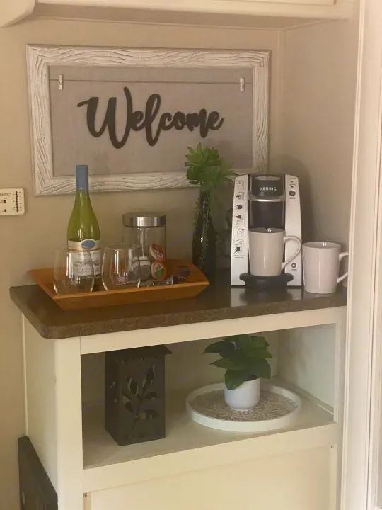 RV rental welcome station featuring Keurig coffee, wine, and homey decor. Enjoy these amenities for a comfortable stay.. Cruiser RV Fun Finder X 2011