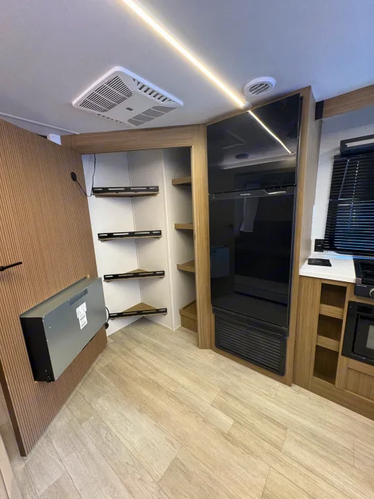 Modern RV rental interior with a full kitchen (fridge, stove, microwave), AC, and varied storage.. Forest River Salem Cruise Lite 26ICE 2025