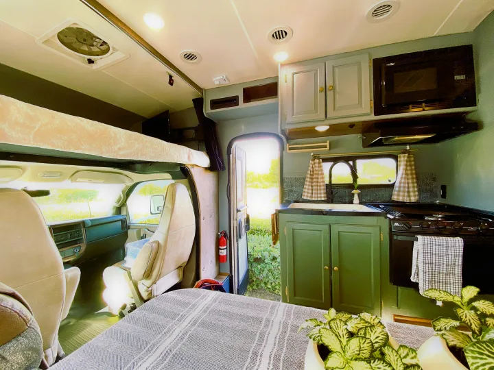 Spacious RV rental interior featuring a full kitchen, comfortable sleeping areas, and easy access, perfect for your next road trip adventure.. Coachmen Leprechaun 2016